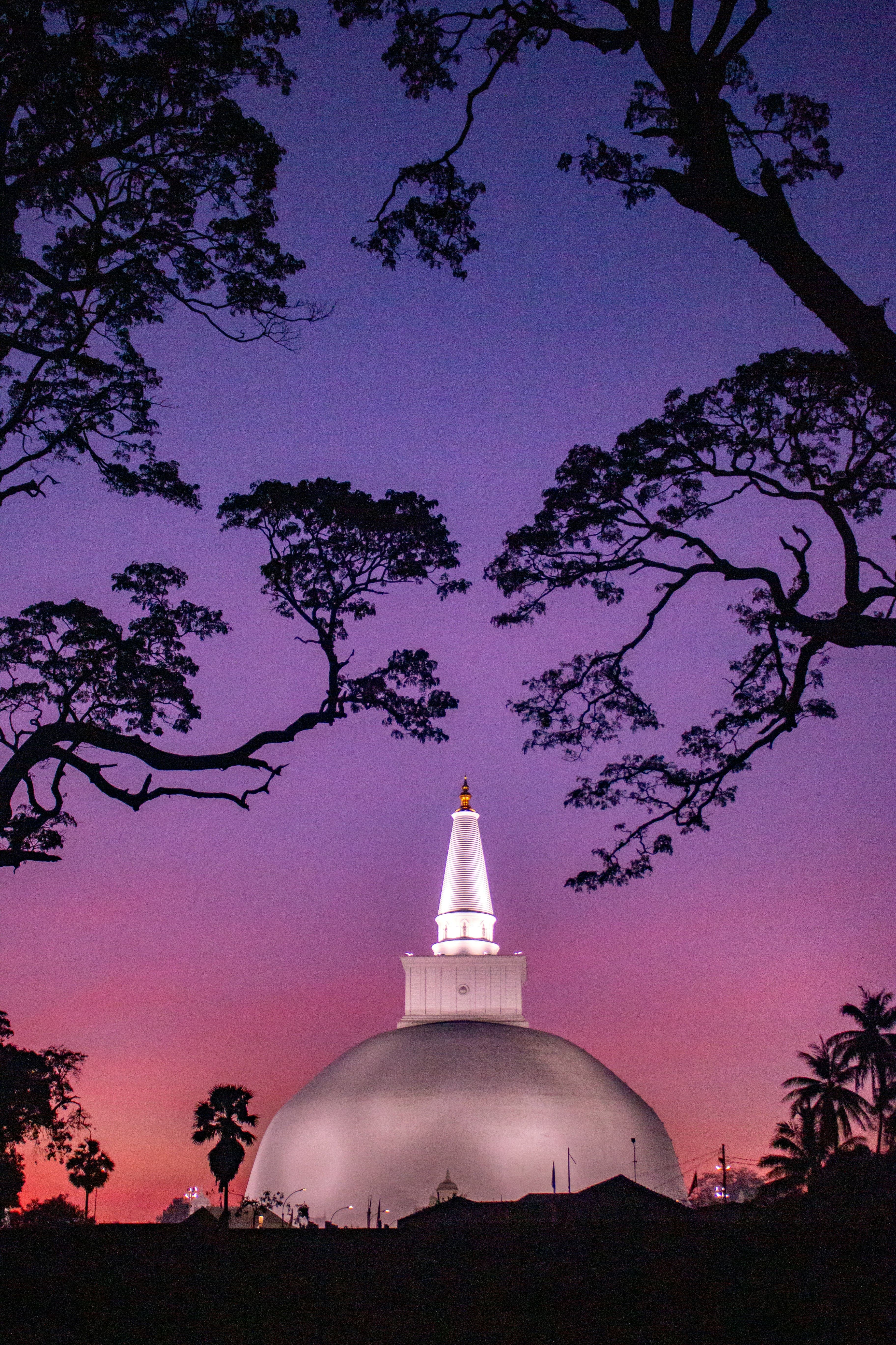 Majestic Ruwanwelisaya stupa surrounded by serene sacred grounds in Anuradhapura.
