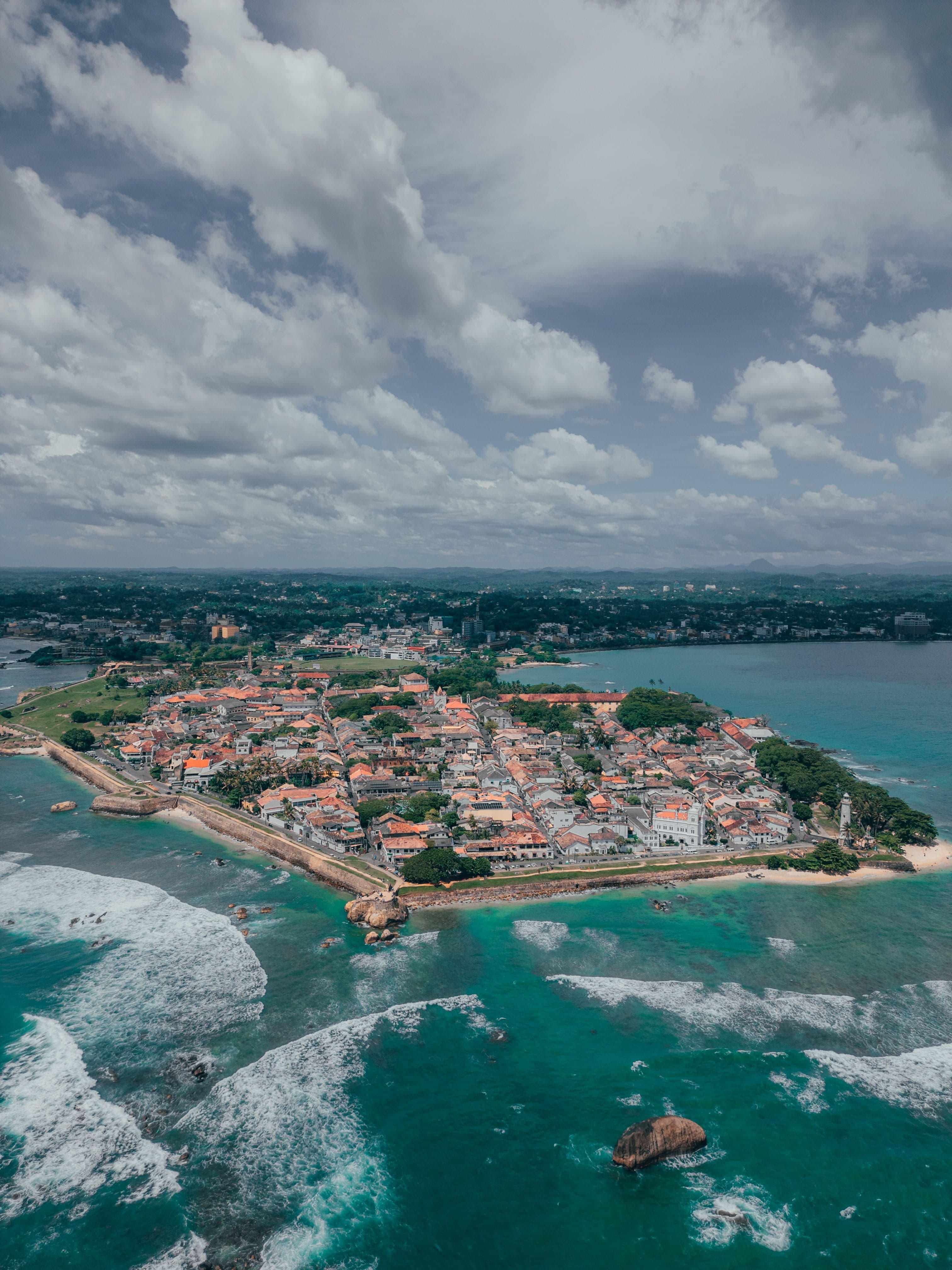 Vibrant tropical blue sea meeting the warm sandy coast of southern Sri Lanka.