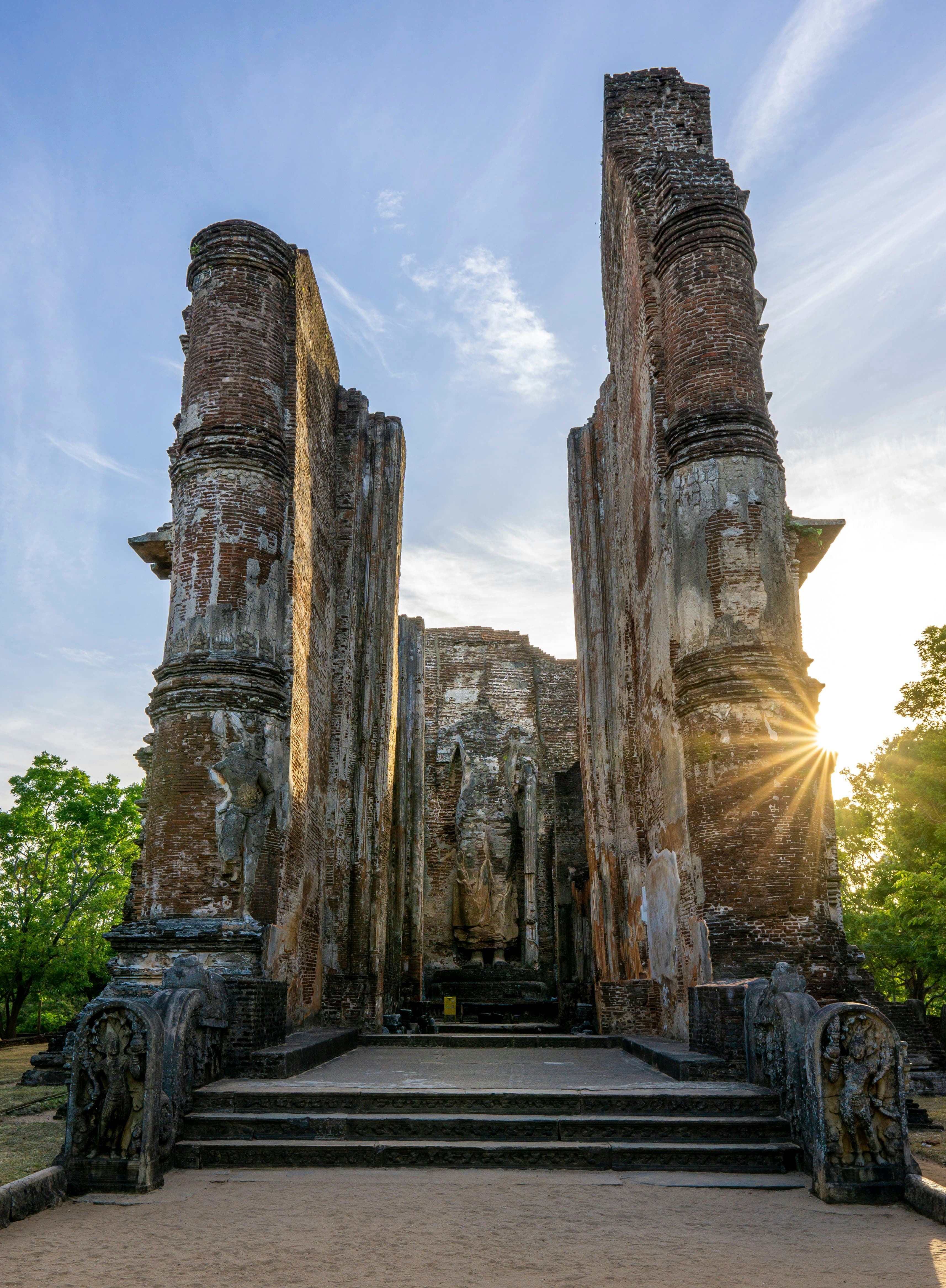 Ancient rock-carved Buddha statue radiating tranquility and timeless spiritual devotion.