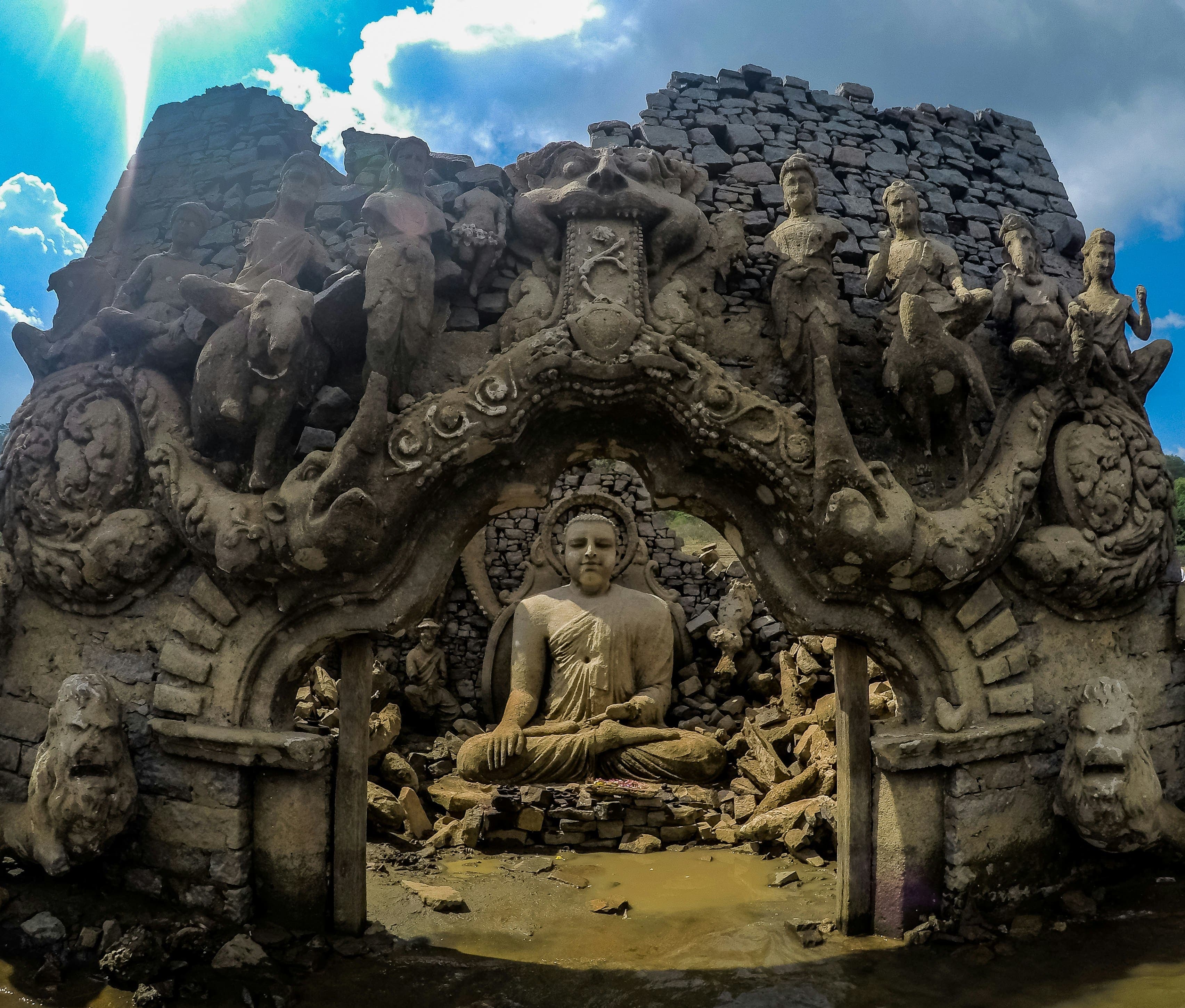 Peaceful seated Buddha statue carved in exquisite traditional Buddhist craftsmanship.