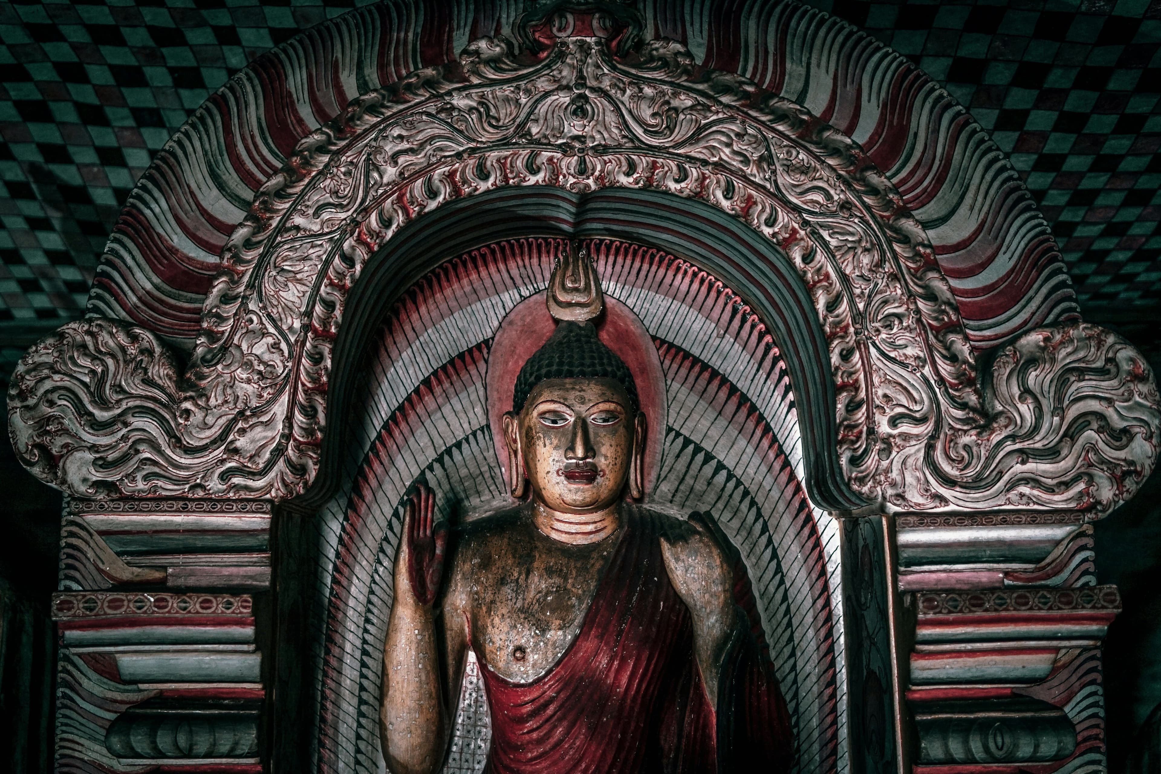 Historic rock-cut Buddha statue radiating serenity and deep meditation.