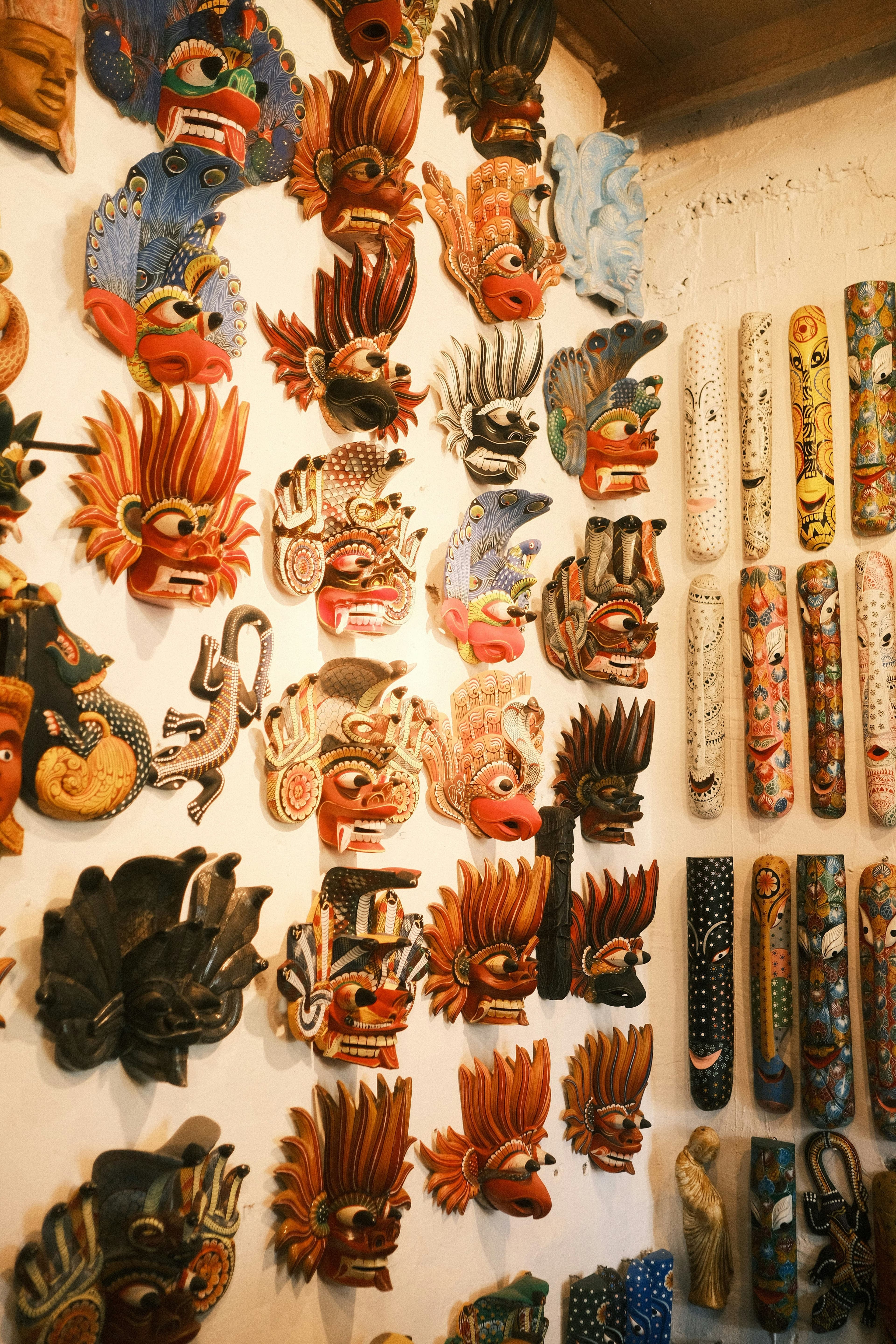 Intricately hand-carved traditional Sri Lankan folklore devil mask with vibrant colors.