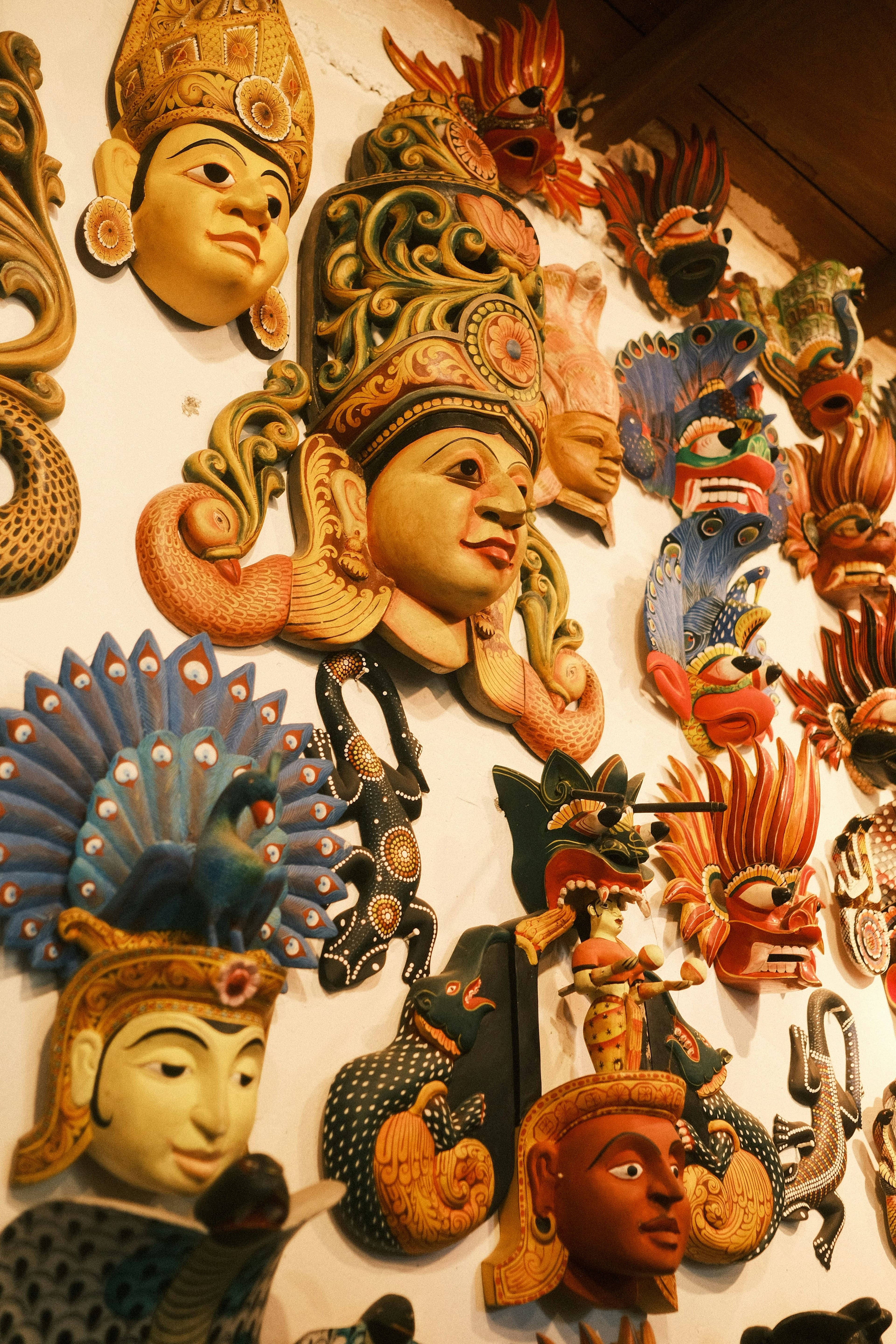 Vibrantly hand-carved traditional wooden mask from Ambalangoda craft masters.