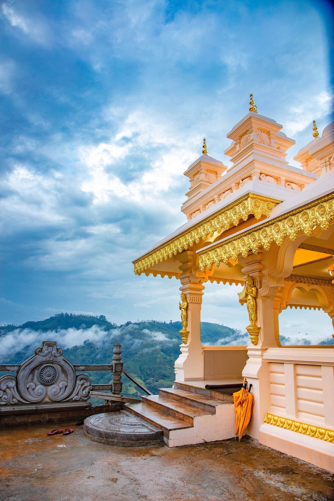Intricately carved temple entrance archway reflecting historic Sri Lankan architecture.