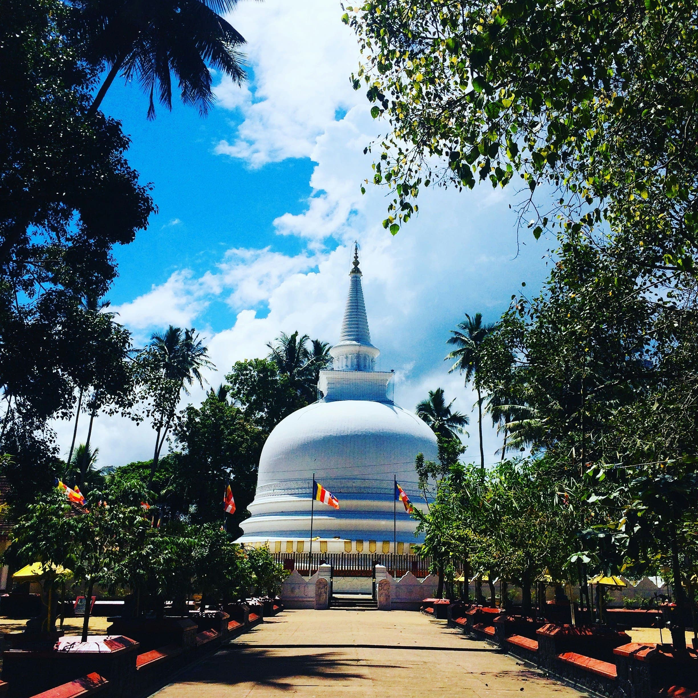 Intricate temple architectural carvings and sacred statues in ancient Sri Lanka.