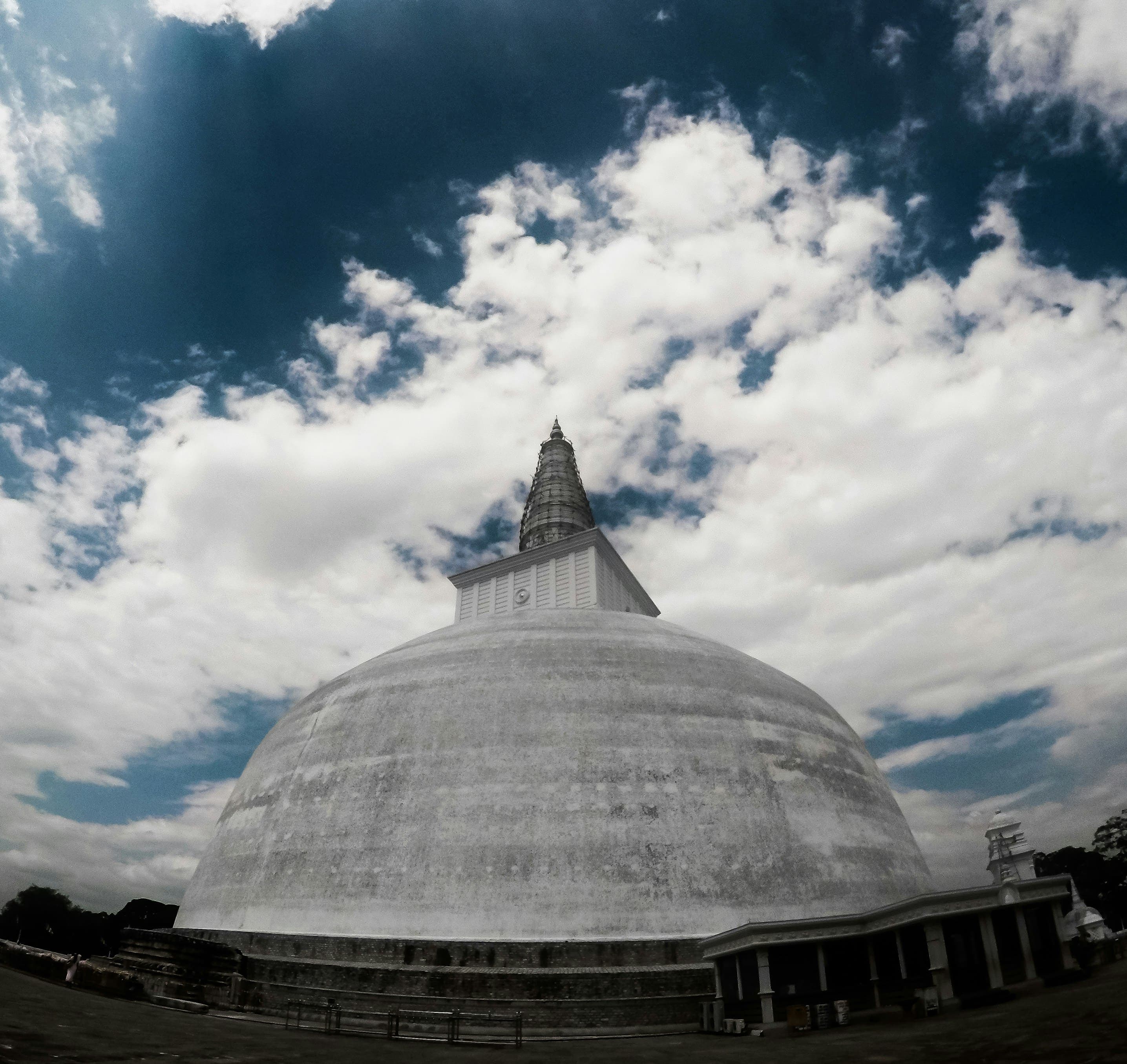 Sacred temple grounds adorned with traditional architectural details in Kandy.