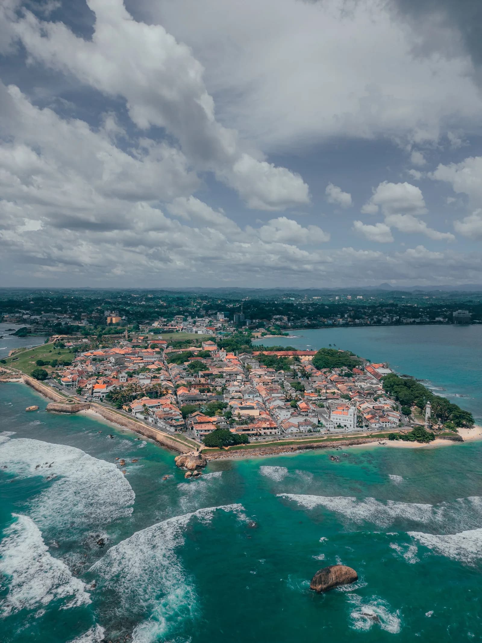Hikkaduwa Beach with coral reef waters and palm-lined shore in Sri Lanka