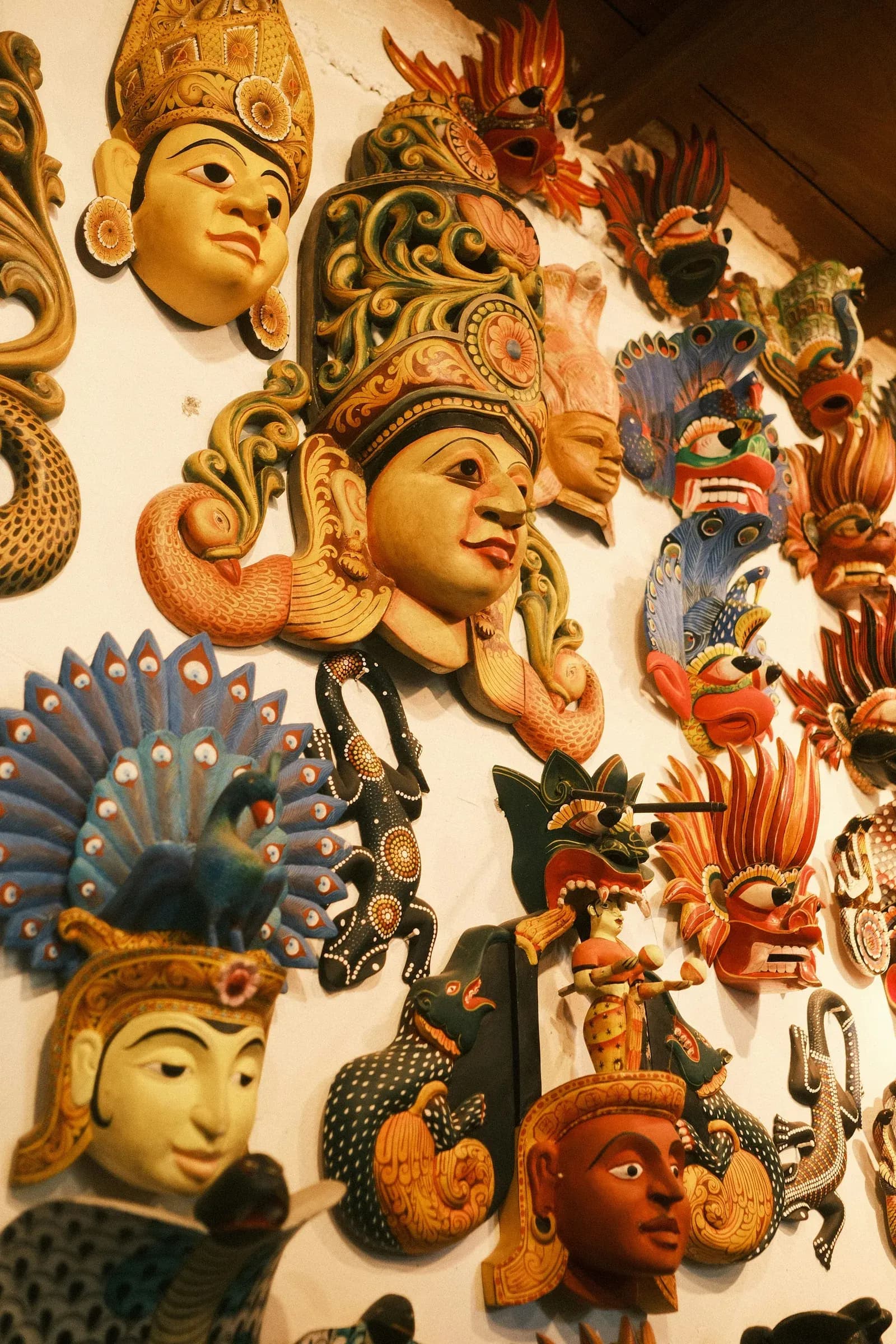 Vibrantly hand-carved traditional wooden mask from Ambalangoda craft masters.