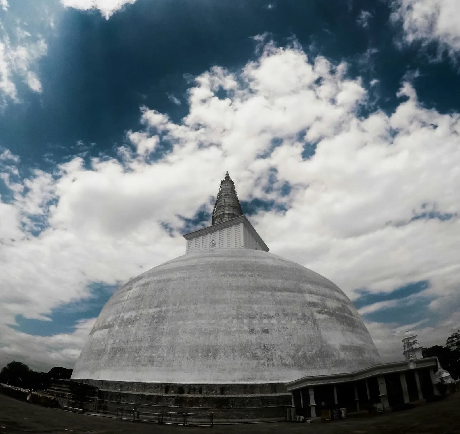 Sacred temple grounds adorned with traditional architectural details in Kandy.